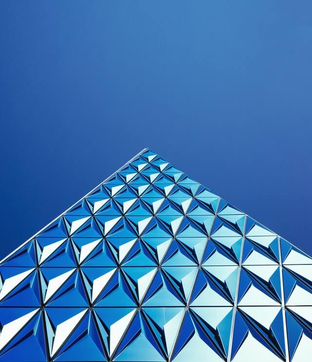 Blue glass facade of a Jurand commercial asset